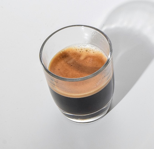 a glass of ristretto coffee